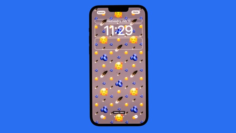 iOS 16 lock screen with emoji background