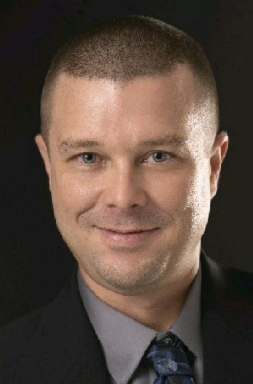Head shot of a man in a business suit